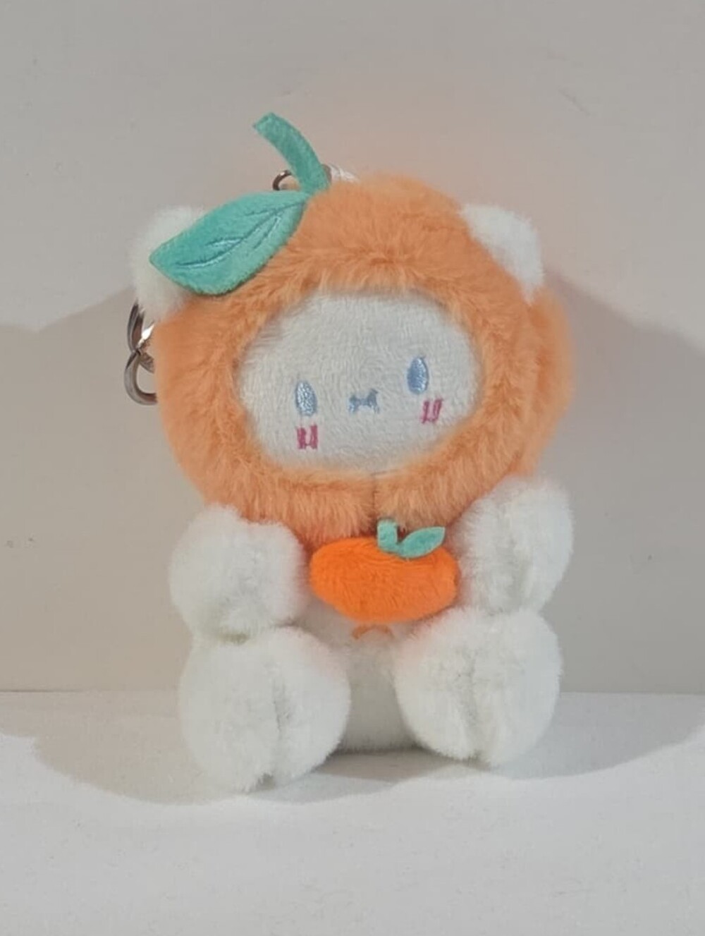 white bear with orange hat plushie keychain